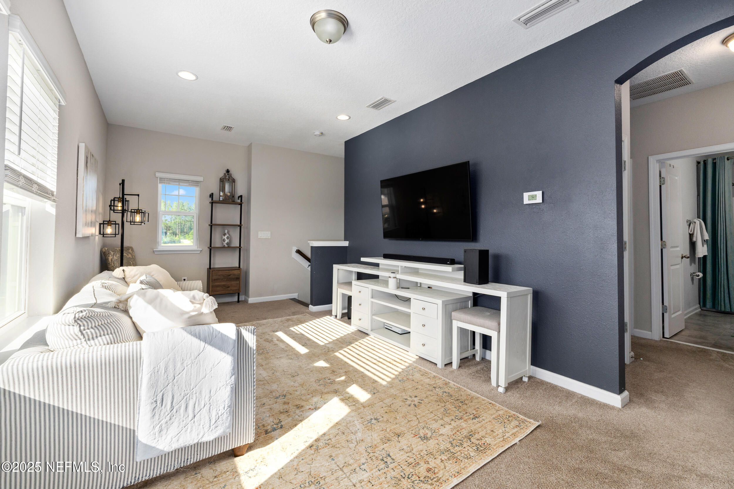 111 Beam Lane St. Augustine, FL 32095 - Photo 25 of 46 a bedroom with a bed and a flat screen tv