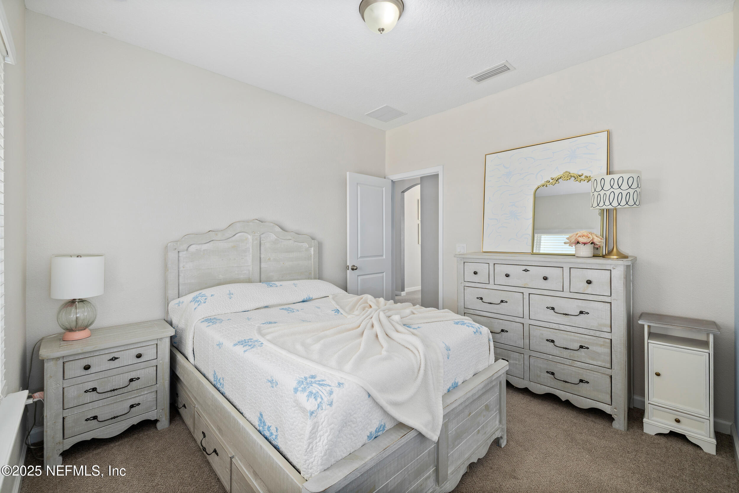 111 Beam Lane St. Augustine, FL 32095 - Photo 26 of 46 a bedroom with a bed and a dresser
