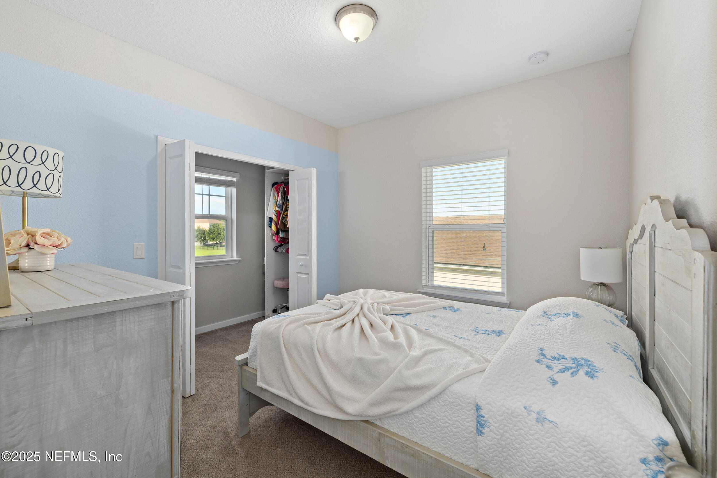 111 Beam Lane St. Augustine, FL 32095 - Photo 27 of 46 a bedroom with a bed and a dresser