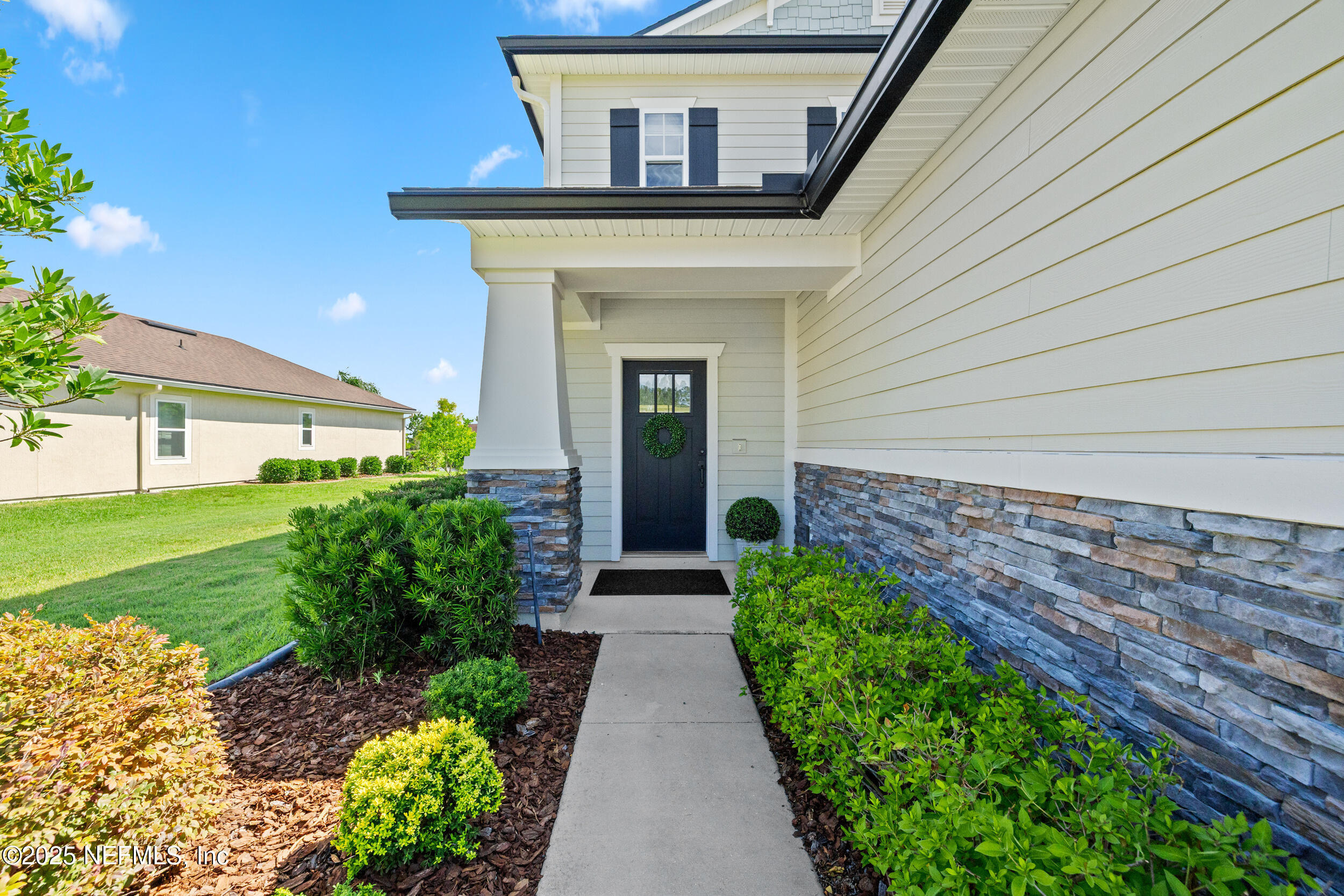 111 Beam Lane St. Augustine, FL 32095 - Photo 3 of 46 a front view of a house with garden
