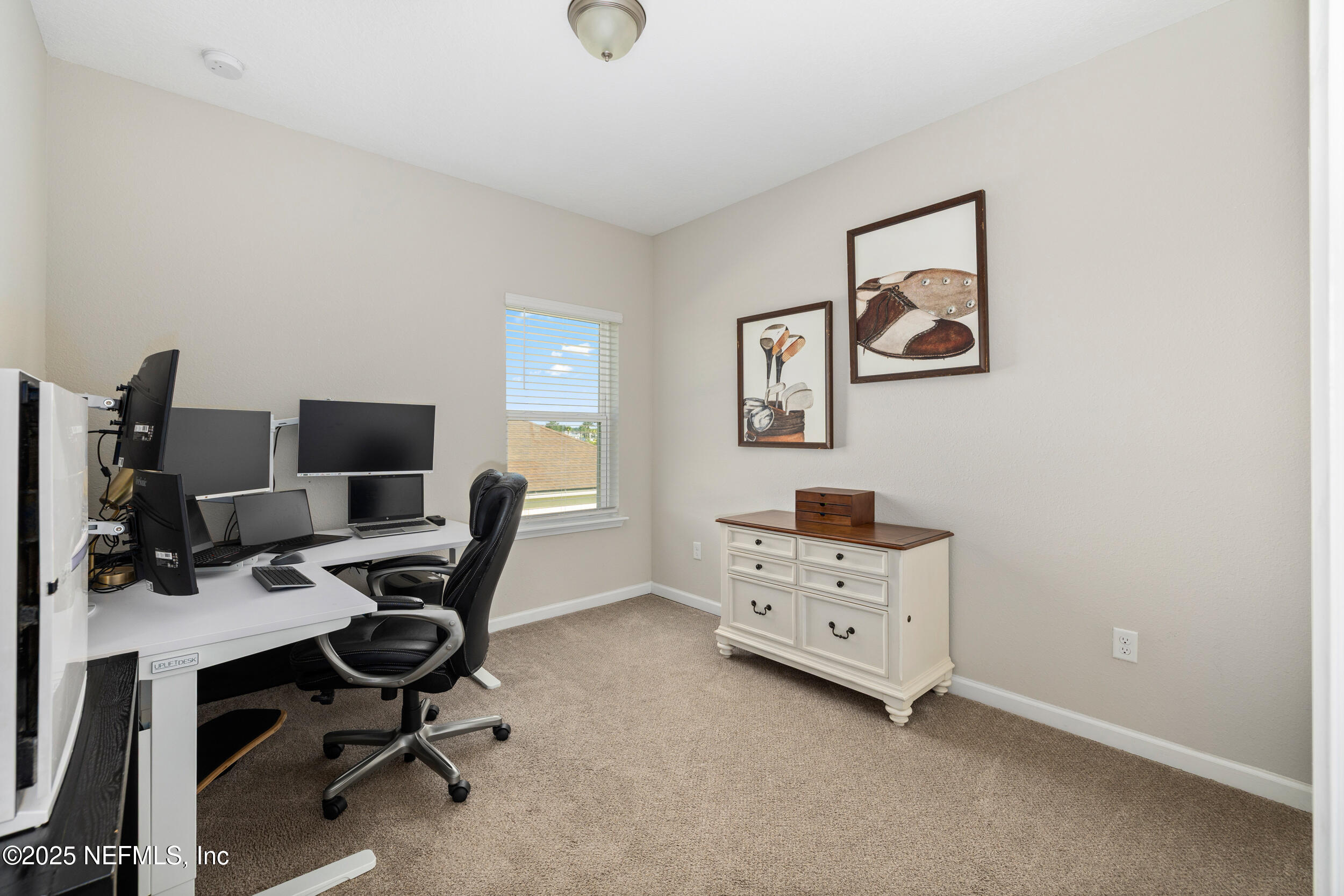 111 Beam Lane St. Augustine, FL 32095 - Photo 31 of 46 a room with a desk and chair