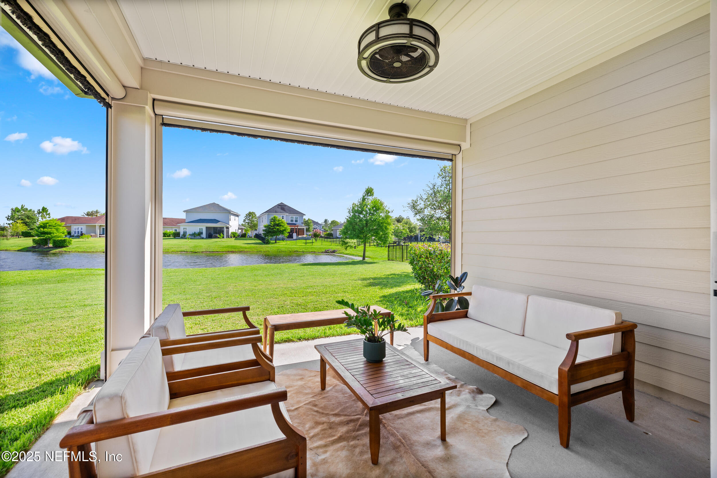 111 Beam Lane St. Augustine, FL 32095 - Photo 34 of 46 a view of a chairs and table in patio with a yard