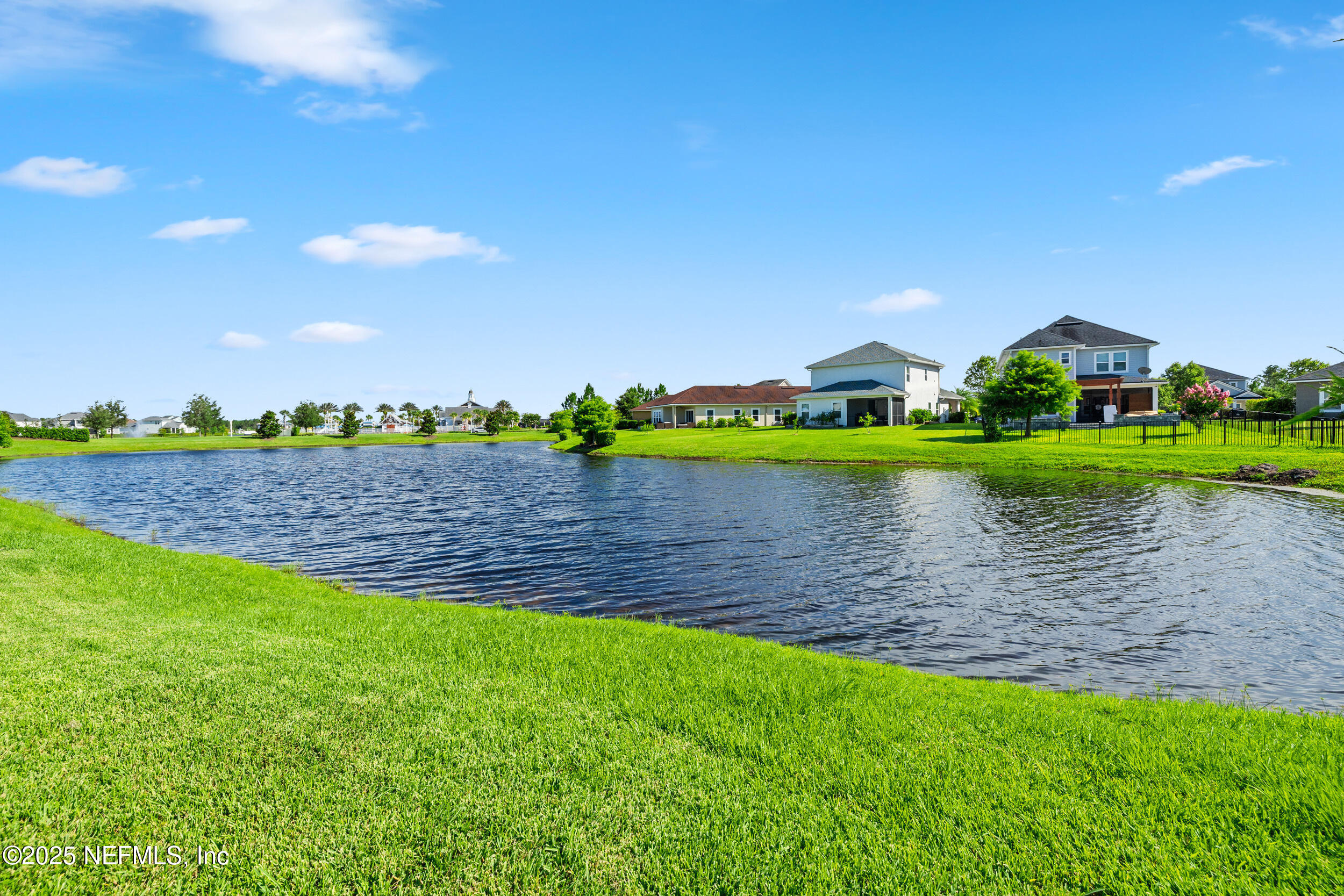 111 Beam Lane St. Augustine, FL 32095 - Photo 39 of 46 a view of a lake with a house in the background