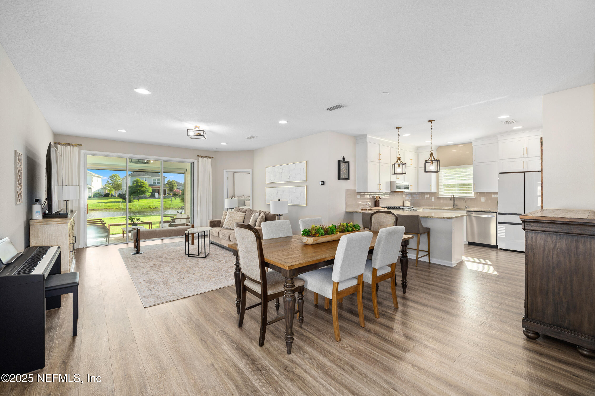 111 Beam Lane St. Augustine, FL 32095 - Photo 7 of 46 a dining room with furniture and a kitchen view