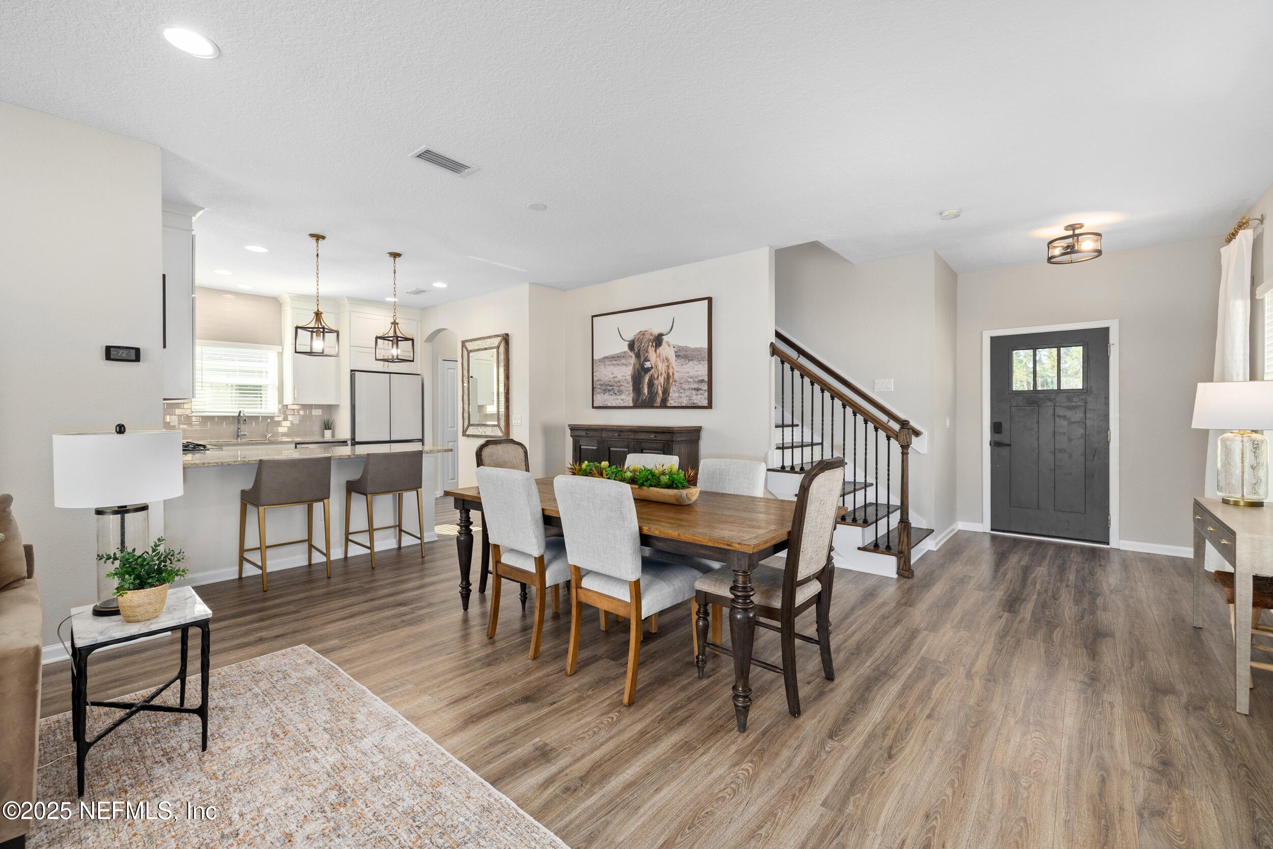 111 Beam Lane St. Augustine, FL 32095 - Photo 8 of 46 a view of a dining room with furniture and wooden floor