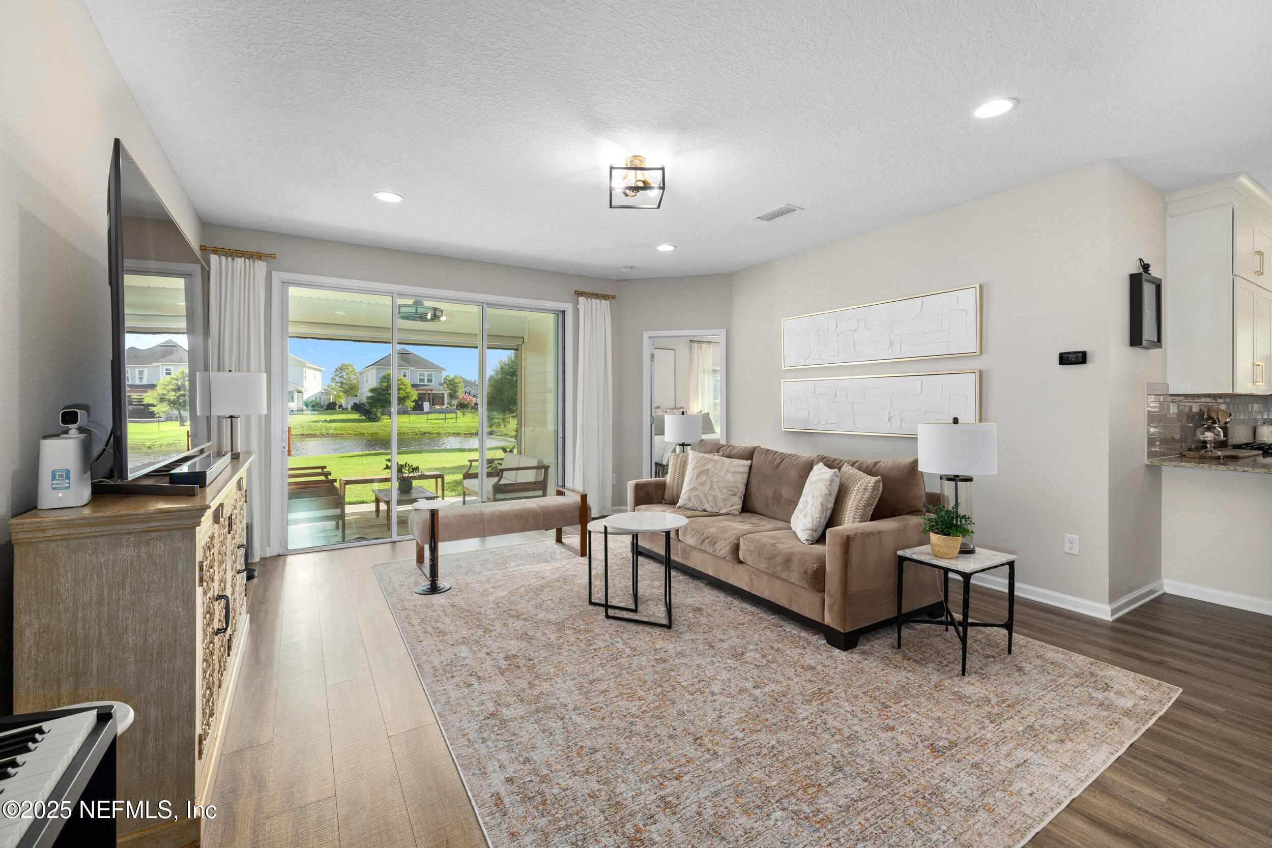 111 Beam Lane St. Augustine, FL 32095 - Photo 9 of 46 a living room with furniture and a large window