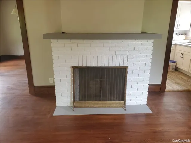 a view of fireplace and wooden floor