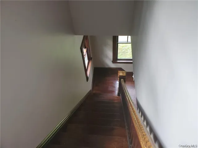 a view of a hallway with windows