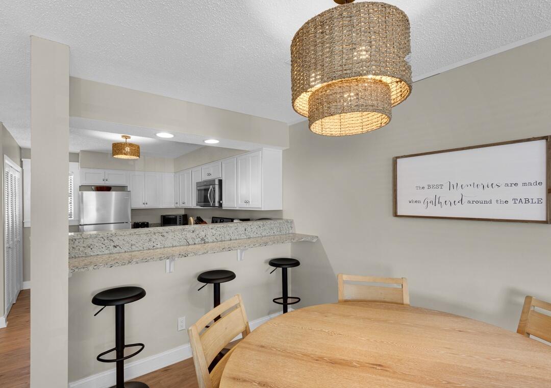 11 Driftwood Road, Unit 9 Miramar Beach, FL 32550 - Photo 11 of 30 a bathroom with a granite countertop sink and a mirror