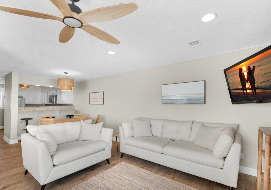 11 Driftwood Road, Unit 9 Miramar Beach, FL 32550 - Photo 12 of 30 a living room with furniture and a flat screen tv