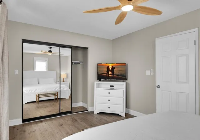 a bathroom with a sink vanity mirror and shower