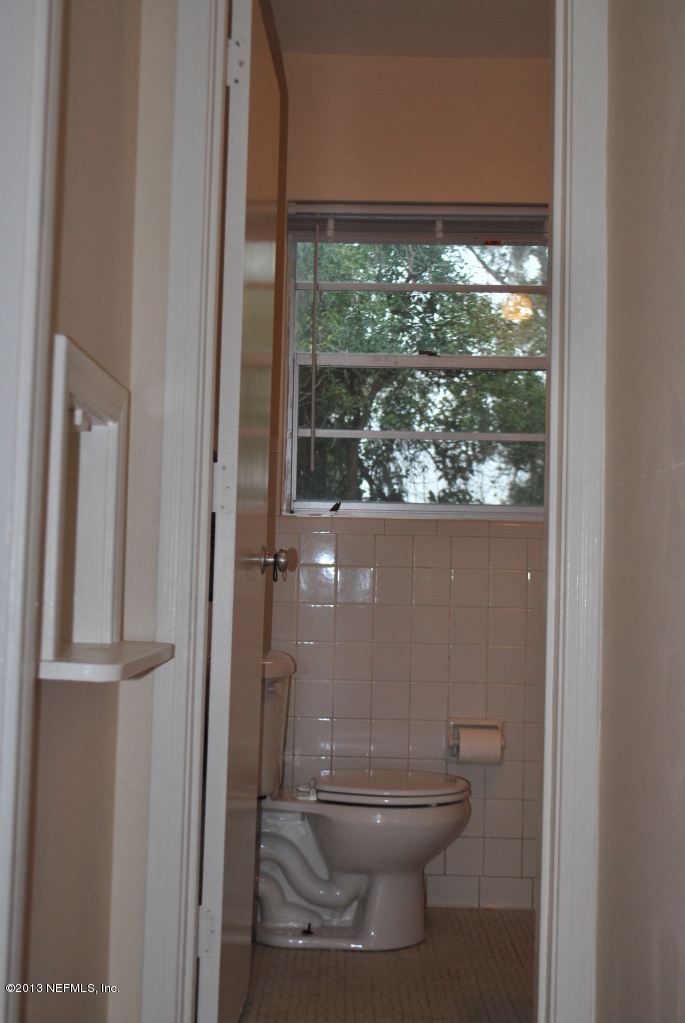 2915 Christopher Road Jacksonville, FL 32217 - Photo 20 of 26 a bathroom with a toilet and a shower