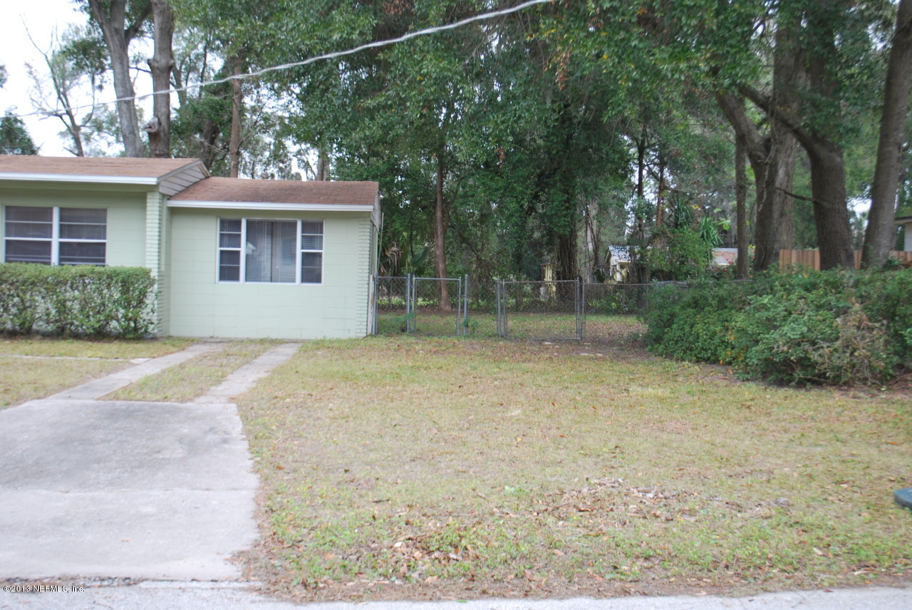 2915 Christopher Road Jacksonville, FL 32217 - Photo 23 of 26 front view of a house with a yard