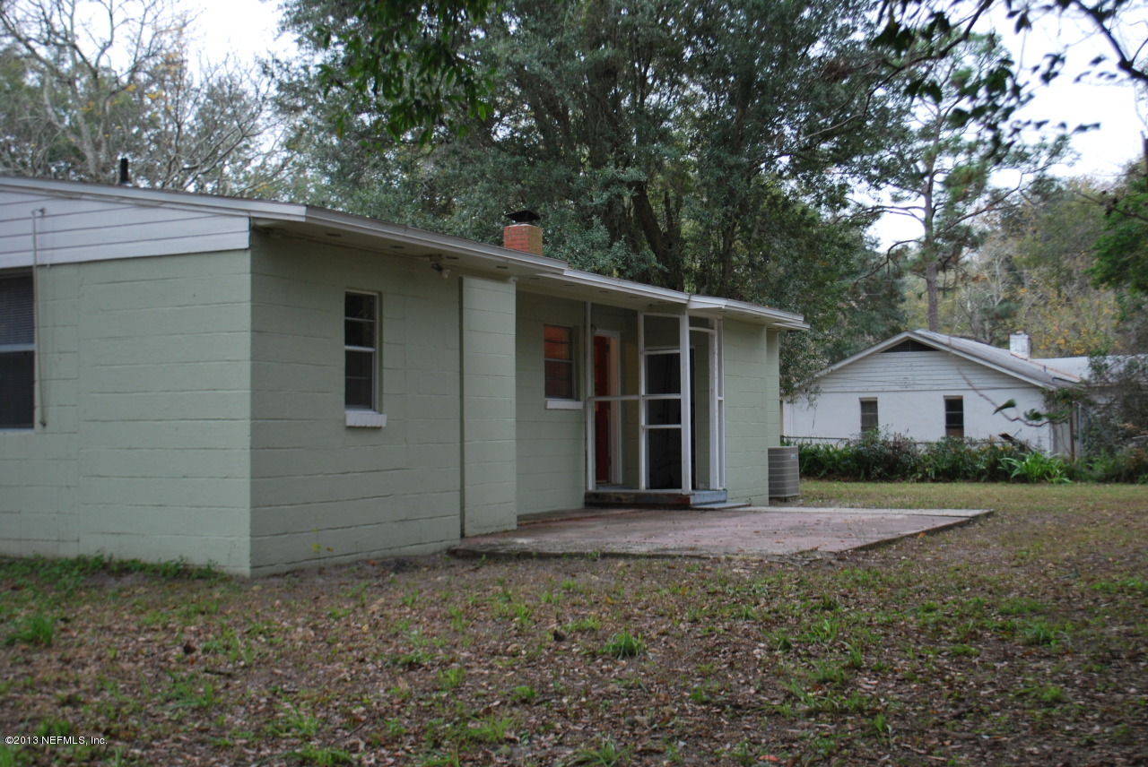 2915 Christopher Road Jacksonville, FL 32217 - Photo 24 of 26 a house with trees in the background