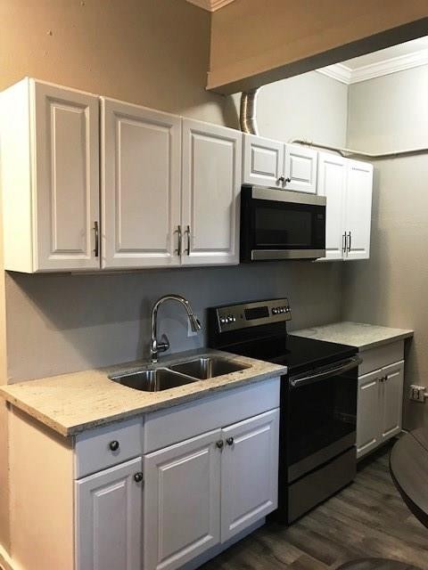 3522 Sampson Street Houston, TX 77004 - Photo 11 of 18 a kitchen with stainless steel appliances granite countertop a sink and a microwave