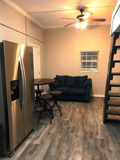 3522 Sampson Street Houston, TX 77004 - Photo 8 of 18 a living room with a couch and a refrigerator