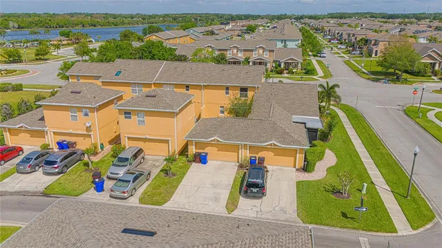 an aerial view of a house with a swimming pool
