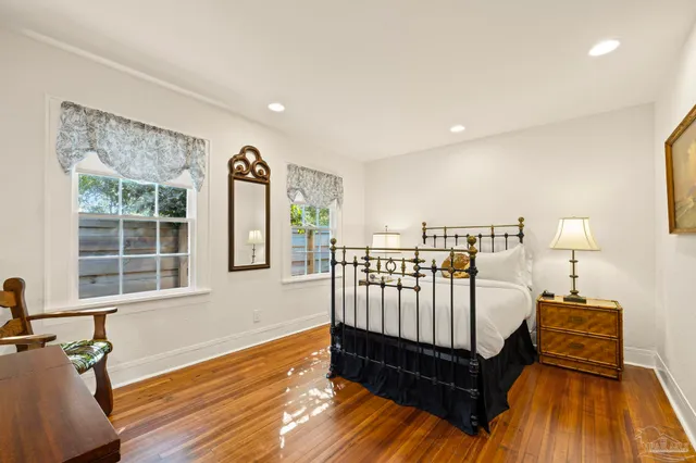 a bedroom with furniture and a window