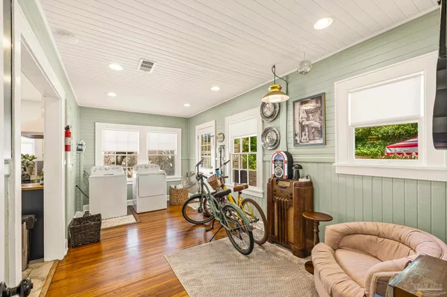 a view of a livingroom with furniture and windows