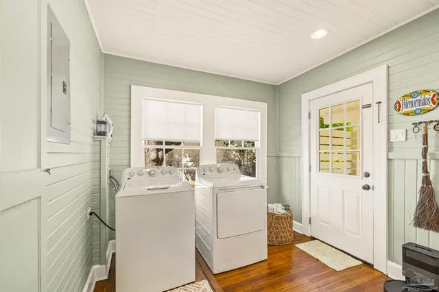 a view of a hallway with washer and dryer