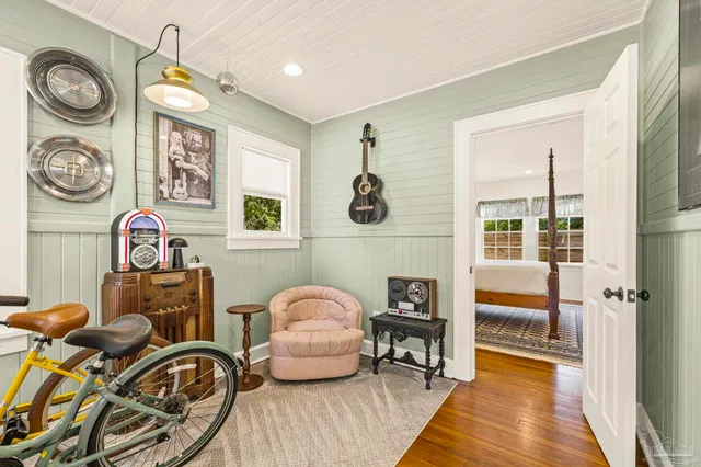 a view of a livingroom with furniture and a window