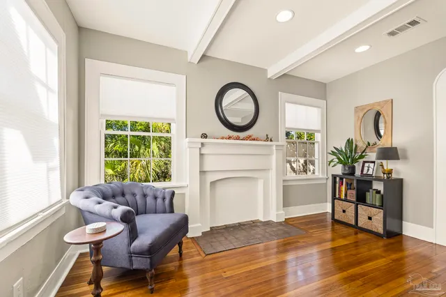 a living room with furniture and a fireplace