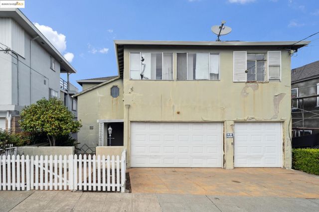 a front view of a house with a garage