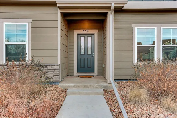 front view of a brick house with a large door
