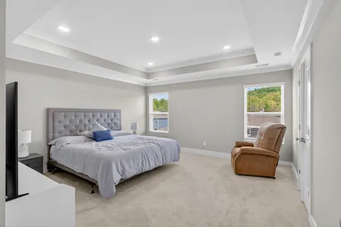 a bedroom with a bed and a couch