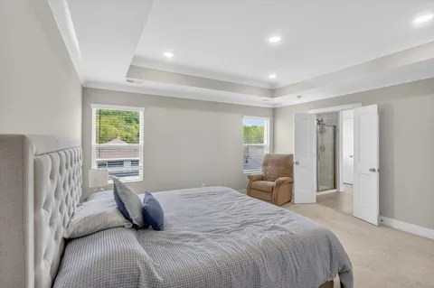 a bedroom with a bed and a couch