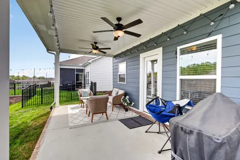 a view of a house with pool table and chairs