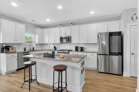 a kitchen with refrigerator cabinets and white appliances