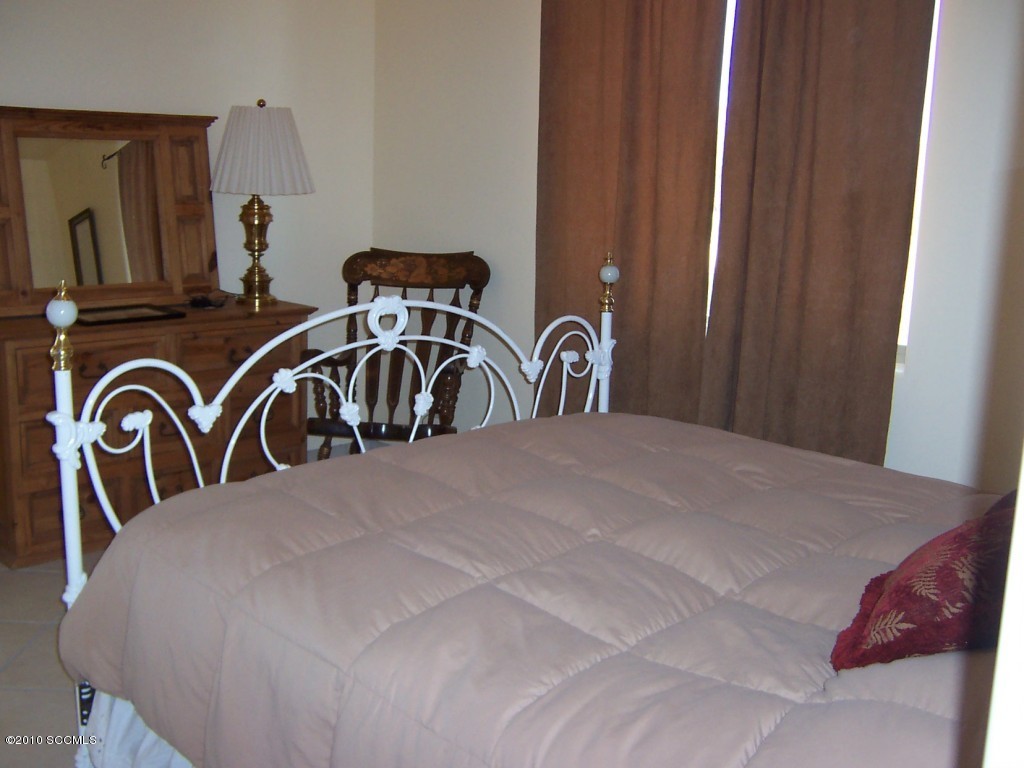 530 Ruth Lane Rio Rico, AZ 85648 - Photo 31 of 36 a bedroom with a bed and a dresser
