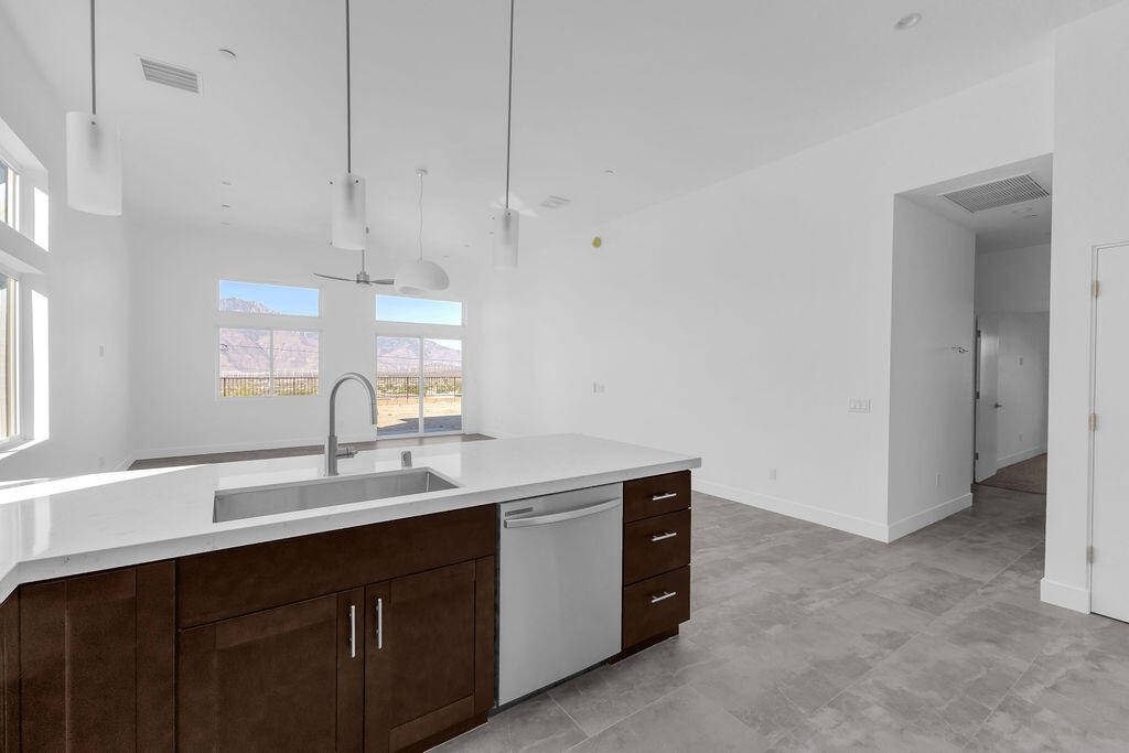 66751 San Felipe Road Desert Hot Springs, CA 92240 - Photo 13 of 59 a kitchen with a sink and cabinets