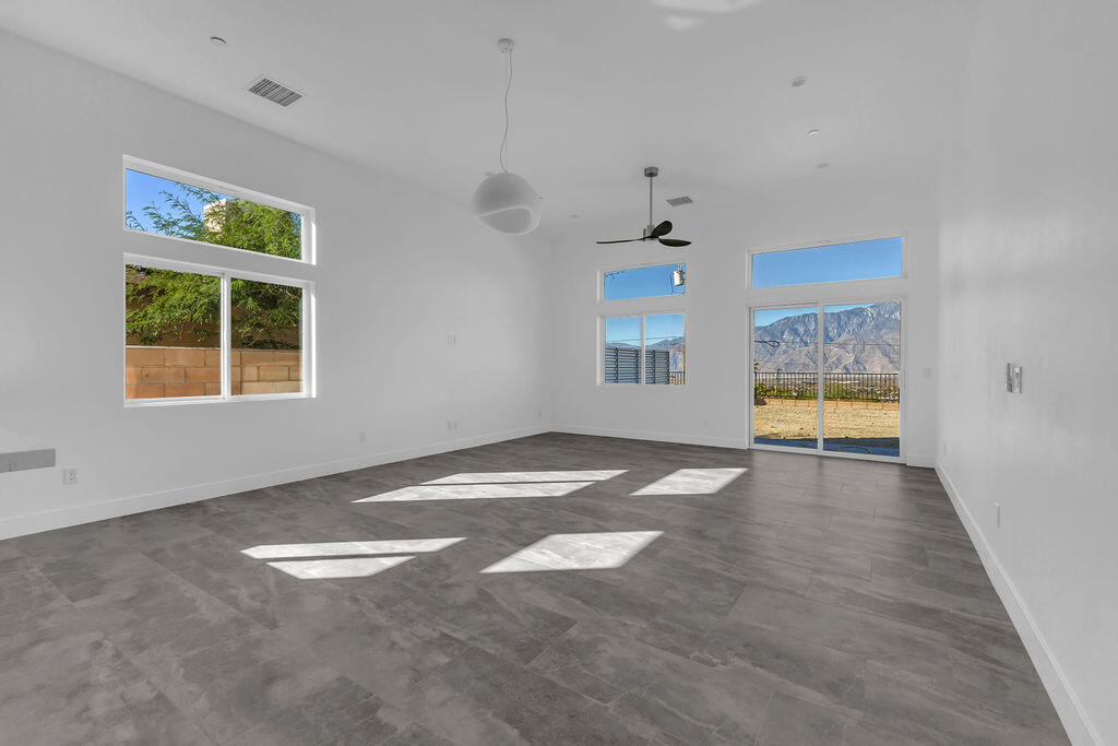 66751 San Felipe Road Desert Hot Springs, CA 92240 - Photo 15 of 59 an empty room with windows