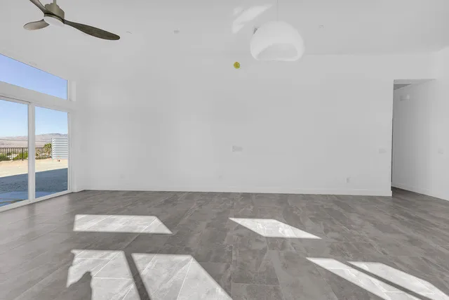 a view of a room with a dishwasher and a window