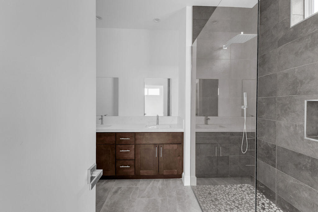 66751 San Felipe Road Desert Hot Springs, CA 92240 - Photo 26 of 59 a spacious bathroom with a shower and a sink