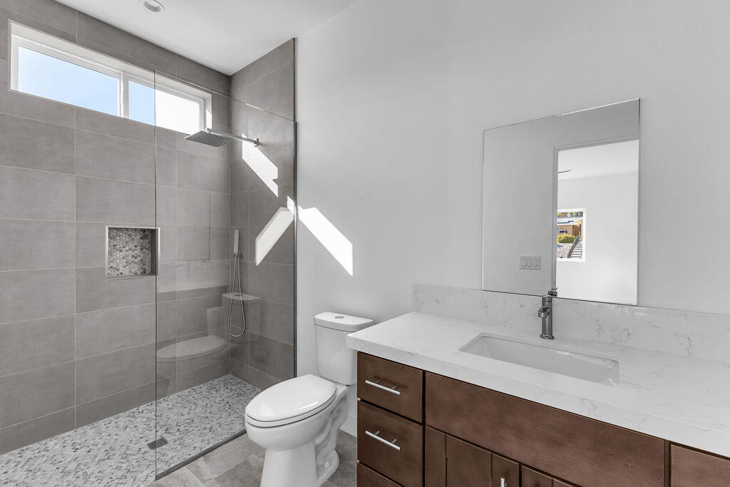 66751 San Felipe Road Desert Hot Springs, CA 92240 - Photo 37 of 59 a bathroom with a sink toilet and shower