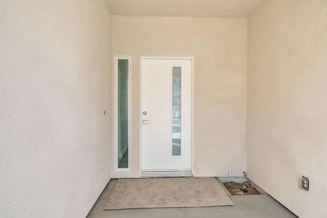 a large kitchen with stainless steel appliances granite countertop a sink a stove and a refrigerator