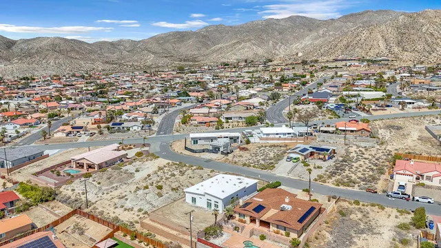 an aerial view of residential houses with outdoor space