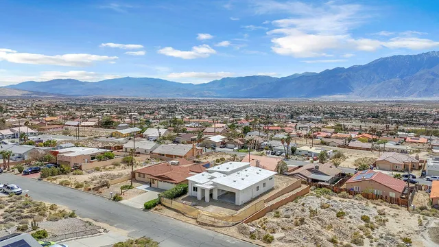 an aerial view of residential house with an outdoor space