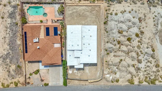 an aerial view of residential house and mountain view