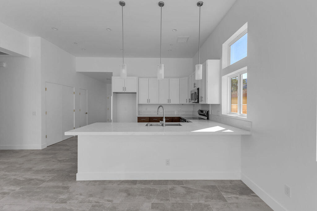 66751 San Felipe Road Desert Hot Springs, CA 92240 - Photo 9 of 59 a view of a kitchen with stainless steel appliances cabinets and a window