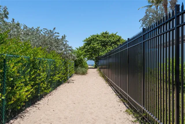 a balcony with trees in front of it