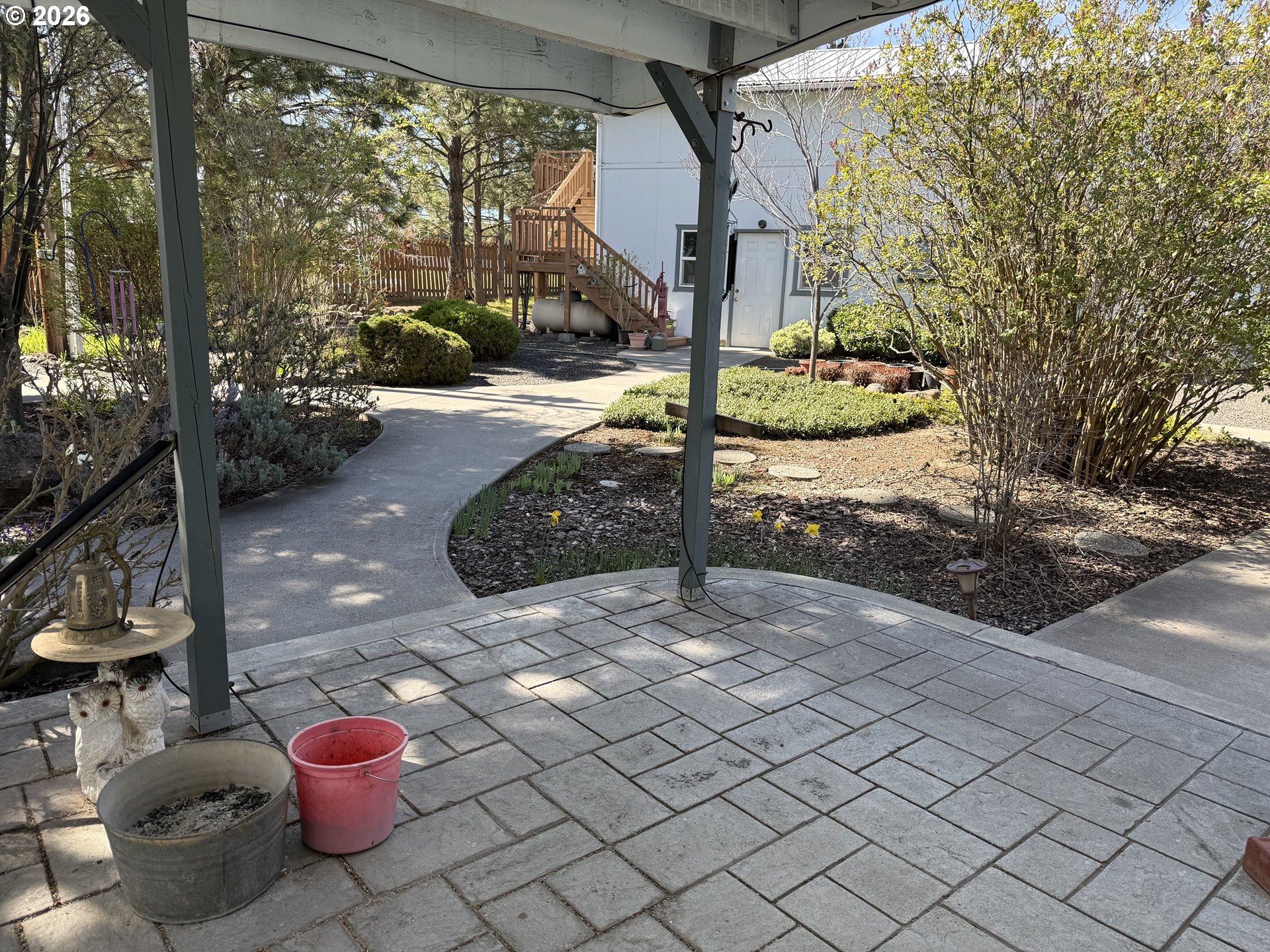 110 South Mike Road Tygh Valley, OR 97063 - Photo 29 of 42 a view of a backyard with table and chairs potted plants