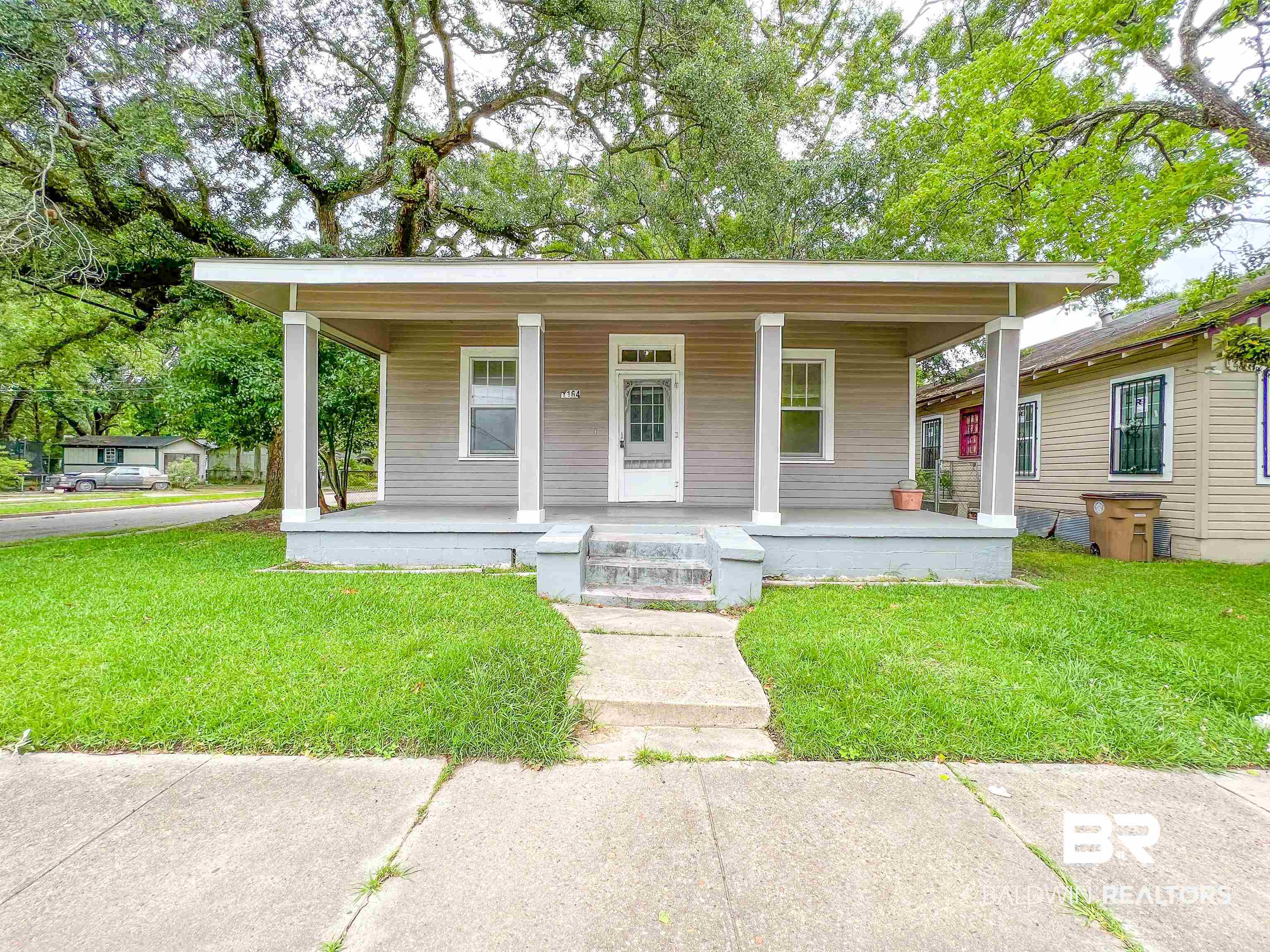 1164 Seneca Street Mobile, AL 36605 - Photo 1 of 22 Bungalow-style house with a front lawn and a porch