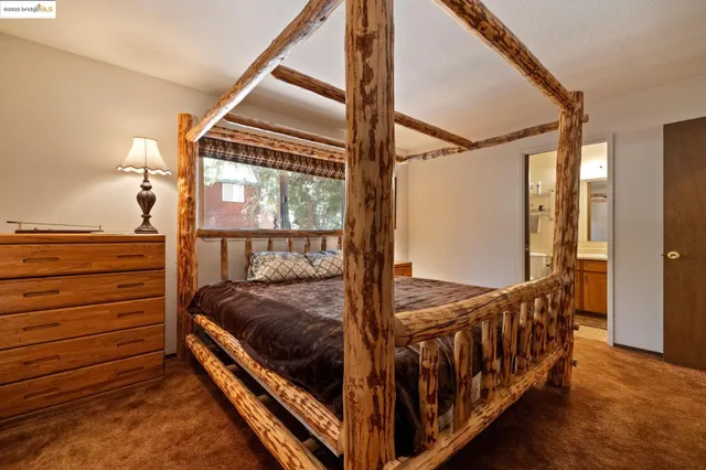 a bed room with a bed and a balcony