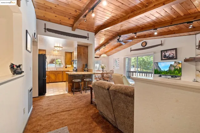 a living room with furniture a large window