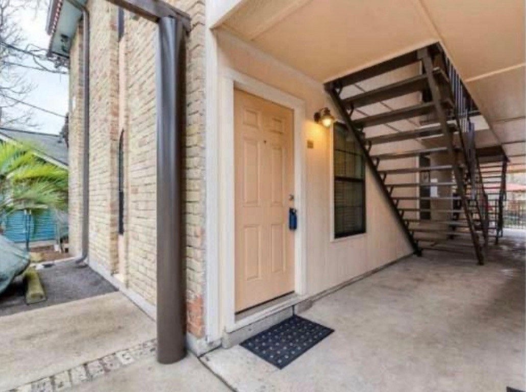 407 East 45th Street, Unit 116 Austin, TX 78751 - Photo 3 of 19 View of exterior entry with brick siding