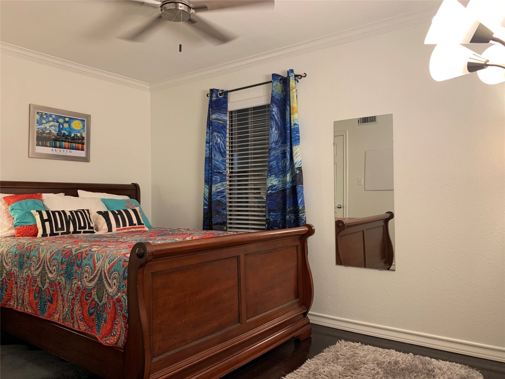 407 East 45th Street, Unit 116 Austin, TX 78751 - Photo 6 of 19 Bedroom with crown molding and a ceiling fan